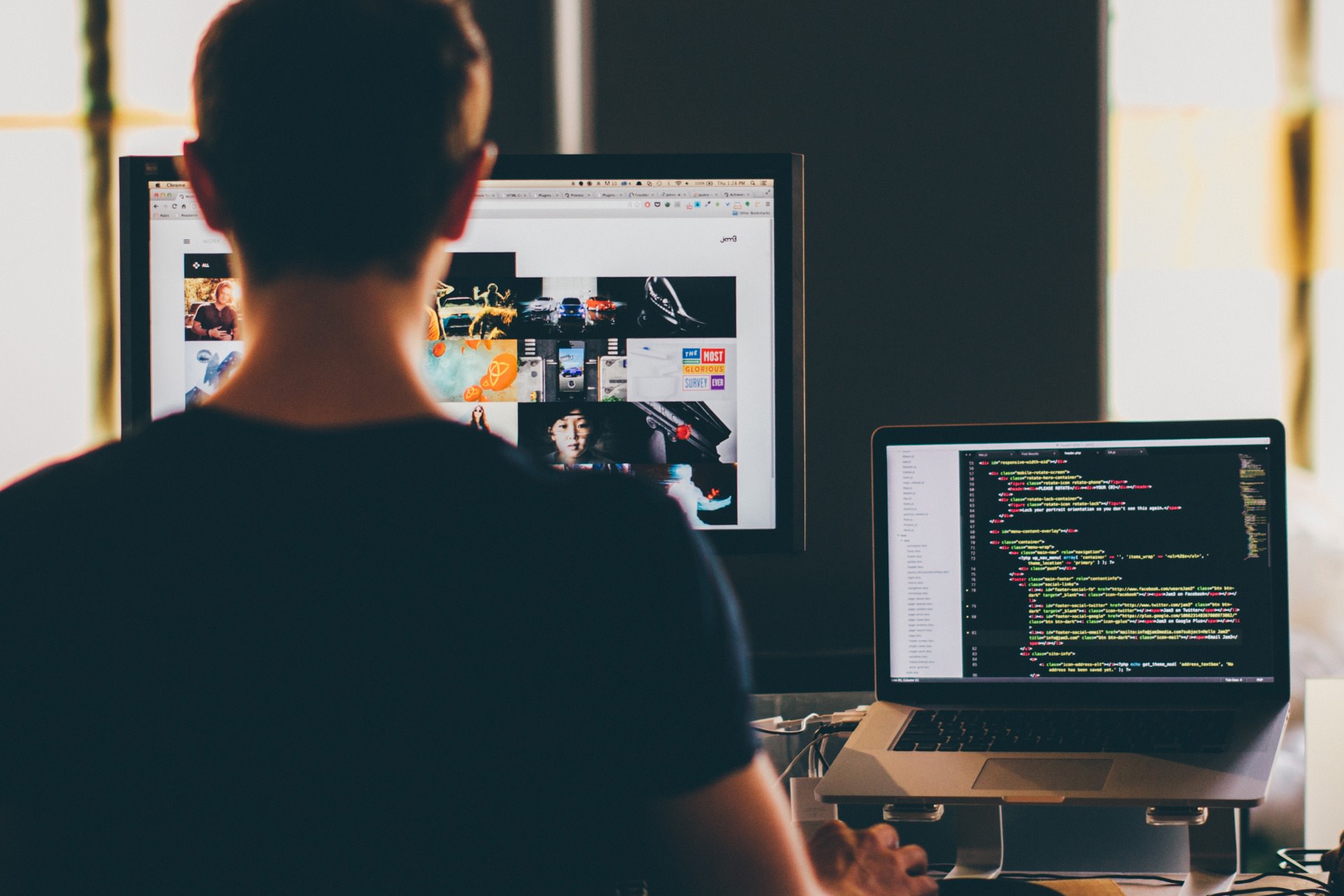 A modern workspace showcasing website development with coding, brainstorming notes, and tech gadgets.